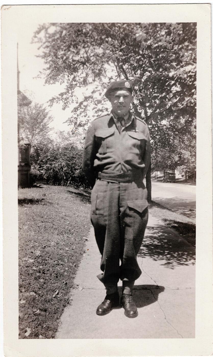 Canadian soldier standing outside.